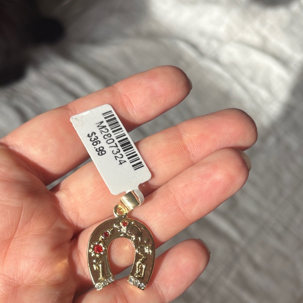Gold Horseshoe Pendant with Red Accents
